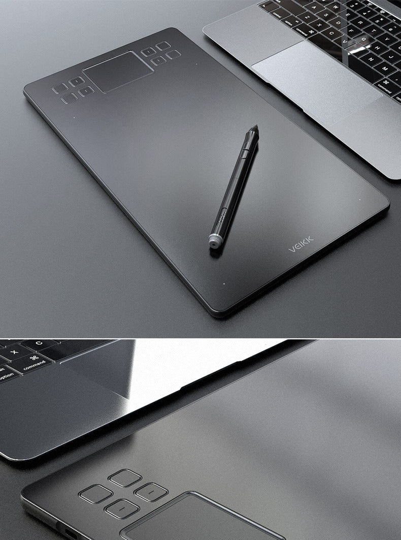Czarny tablet graficzny z piórkiem na biurku